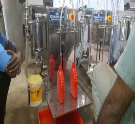 VOLUMETRIC LIQUID FILLING MACHINE.